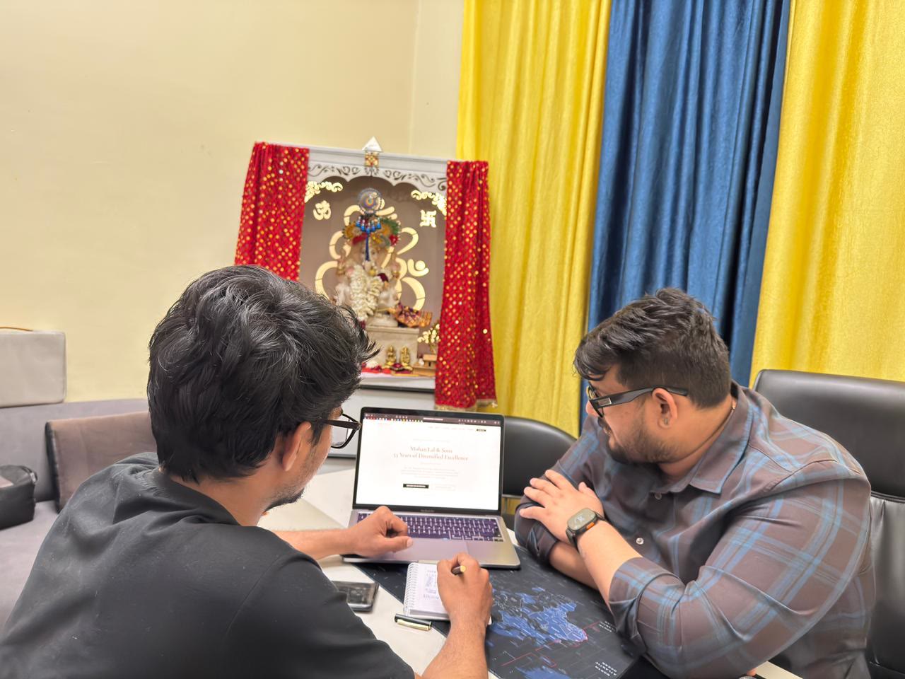 An Inook AI team member reviewing a client's website on a laptop with the client